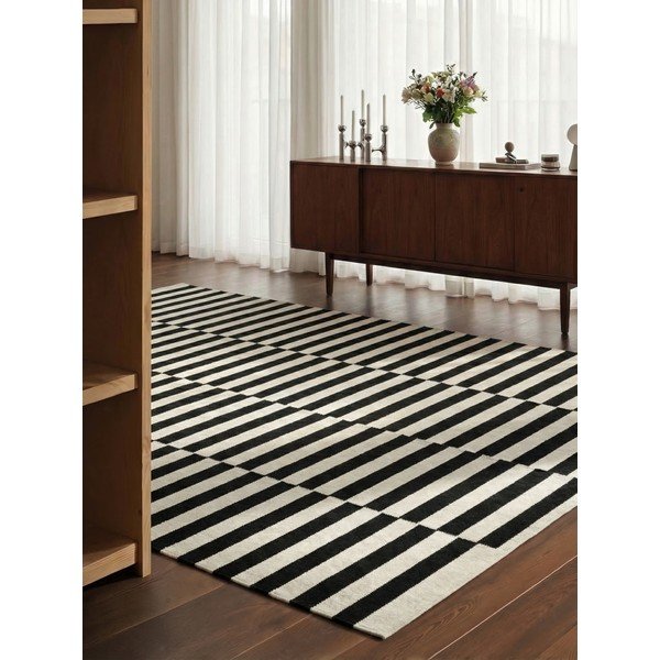 Fekete-fehér kétoldalas kézi szövésű gyapjú szőnyeg 200x300 cm Donna – Hanse Home-image-1