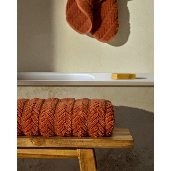 Terrakotta színű frottír pamut törölköző 50x90 cm Rune – Kave Home-image-1