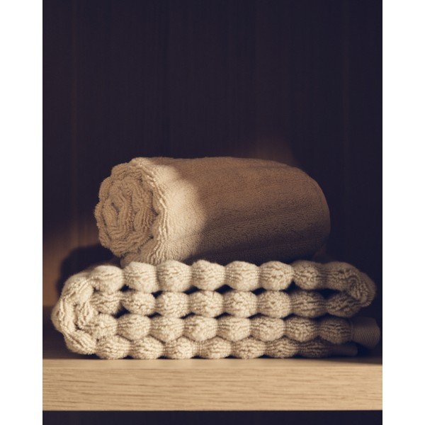 Bézs frottír pamut fürdőlepedő 70x140 cm Navira – Kave Home-image-1